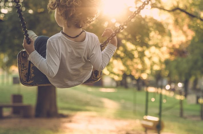 Student Swinging at Recess