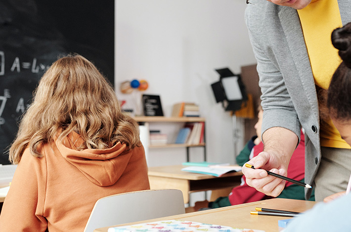 Teacher Helping Student